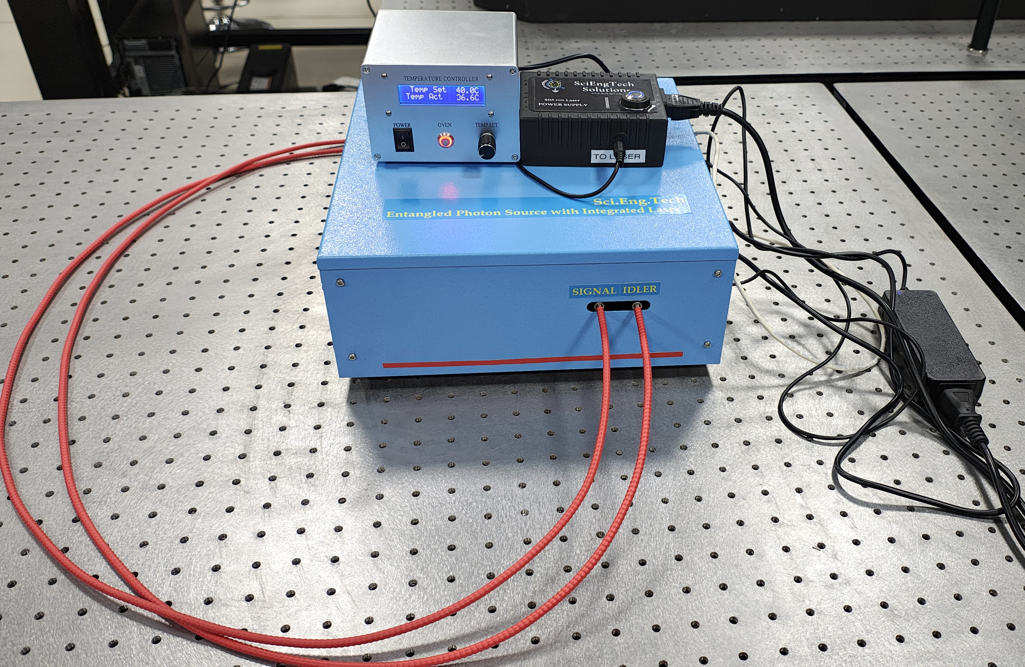 Entangled Photon Source with Integrated Laser